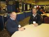 Eldon Evans (L) of Victor L. Phillips Co. sits with Pat Meara, The G.W. Van Keppel Co. at the associates expo.
 