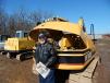 Wayne Rambo of Rambo Auto, Wheeler, Wis., takes a look at this Cat 307B excavator to add to his equipment.
