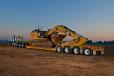 The 55-ton (50 t) tri-axle trailer featuring a 26-ft. (7.9 m) long by 9-ft. (2.7 m) wide deck provided maximum stability to haul wide machines, such as articulated dump trucks, large excavators and cranes, that operators used to extract Corvettes from the 