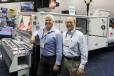 Albert Ribeiro (L), sales and marketing manager, stands at the Wilcox Bodies Ltd. booth with Tom Catalano of Curry Supply Company.
 
