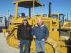 Tyler Maiden (L) and Carlos Mogan shop the inventory of Cat dozers.
 