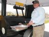Darryl Thompson, Power Equipment Company’s west Tennessee region manager, works hard to keep his guests well-fed with plenty of barbeque off the company’s one of a kind mobile grill/smoker/fryer. 