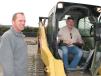 Delmer Bowman of CD Auto, Cookeville, Tenn., and Harold Qualls of Schubert & Qualls Construction, Crossville, Tenn., wait for the compact track loaders to go on the auction block. 