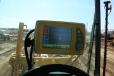 Inside the motorgrader cab, the Topcon GX-60 control box gives operators real-time location and cut/fill information.
 