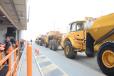 Volvo artic trucks roll over the auction ramp. 