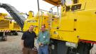Rich Somers (R) of Innovative Construction Services, Folcroft, Pa., and Keith Littler of Stephenson Equipment look over the center-mounted BM 1300/30 mill from Bomag. 