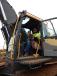 Roman and his son Jayden Maslow of MVE, Columbus, Minn., try out this Volvo EC480EL excavator.  