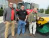 (L-R): Jason Kenworth and Randy Porter, both of Ohio CAT, join Keith Smith of Smith Challenger, sweeper brush manufacturer, at Ohio CAT’s outdoor equipment display.
 