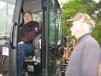 Ernest Jones (L), semi-retired contractor of Dahlonega, Ga., and Fred Miles of Mi-Com, Whitesburg, Ga., talk about the possibility of bidding on this JCB 8035 ZTS. 