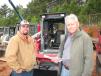 Aaron (L) and Jeff Steele, both of Steele & Associates, Alpharetta, Ga., compare notes on this lineup of Takeuchi compact track loaders. 