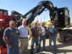 (L-R): Joe Weyer, Weyer Logging; Cory Vrolijk, Fabick CAT; Matt Weyer and Jim Weyer, both of Weyer Logging; and Dan Linder, town of Loyal; stand in front of this Cat 501HD processor equipped with a PF-48 processing head.
 