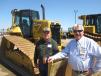 Dennis Ruid (L), owner of Ruid Excavating talks with Mike Lurndal of Fabick CAT in front of a Cat D6N LGP dozer.
 