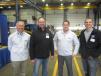 Craig McArton, executive vice president and COO Fabick CAT; Chris Goss, Hoffman Construction; Jim Sands, Fabick CAT; and Shawn Hoffman, Hoffman Construction, Black River Falls, Wis., tour the shop area at the annual open house in Eau Claire, Wis.
 