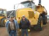 Gary Edler (L) of Division Road Sales and Gregg Stauber of Stauber Trucking inspect this Volvo A40D articulated truck. 
 