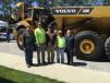 (L-R): Roger Koss of Class 7 Repair in Raleigh; Benjamin and Ben Slaughter and Harold Vaughn, all of HTI in Fuquay-Varina; and James Crane of ASC Construction Equipment stand with the Volvo A40G golden hauler. 