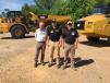 (L-R): John Thornton and Clarence Howard, both of Thunder Enterprises in Chattanooga, look over the newly introduced Cat 745C and 730C articulated  trucks with the help of Wes Reece of Stowers Machinery. 