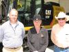 (L-R): Wade Burrow, Thompson Machinery,  welcomes some of his friends and customers to the event, including Bruce Prewett and Dave Moore, both of Prewett Enterprises, Southaven, Miss. 