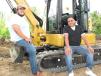 Thompson Machinery customers Louis (L) and Luis Sandoval of Professional Excavator Services/Sandoval Footings, based in Memphis, Tenn., take a brief break before operating another machine of interest. 