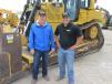Carl Hoerr (L) of Hoerr Machinery in Peoria, Ill., relies on Taylor Meyers, IronPlanet, territory manager of Dallas and East Texas, for information concerning this Cat D6T dozer. 
 