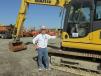 Tom Cobb, Cobb Equipment Inc. of Republic, Mo., gives this Komatsu PC 130 excavator a thorough inspection. 
 