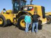 Randy Putman (R) and his son, Dillon, of Putman Inc., Daingerfield, Texas, think this Cat 950K wheel loader will fit perfectly into their rental fleet. 
 