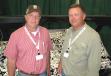 FAE USA’s Earl Alsobrook (L) talks to one of his attachment distributors, James Jewell of TriGreen Equipment in Alabama. 