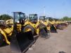 Wheel loaders are lined up and ready to get to work for new owners during the One-Day Sale. 