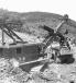 Fermo Bianchi photo
A P&H 1055 shovel with a 3 ½ cu. yd. (2.6 cu m) dipper is loading rock and earth into a Euclid 22-ton truck. The Weir excavation was taking place on July 21, 1950. 