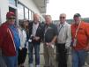 (L-R): Dave Prentice, Phoenix Services; Michelle Tosto and Mike Schwartz, Utility Services; Tom Ellis, president, Howell Tractor & Equipment LLC; Jack Lanigan, president of Lanco group of companies; and Gray Bowser, Phoenix Services, get ready for the Indy 500 time trails at the Mi-Jack suite.
 