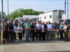 Peter Clark, Yoder & Frey owner, cuts the ribbon to mark the first annual Ashland, Ohio, spring auction. 