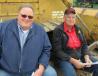 Ed Merritt (L) of Tractor Service & Supply Company and Gary Seals of Berne Reclamation, found a comfortable seat to watch the auction activities. 