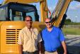 Allen Cowart (L), Space Coast Sitework, chats with  