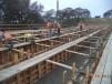 Myers & Sons Construction Company L.P. places concrete for the stem and soffit for the westbound off-ramp bridge.
 