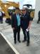 Pete Morita (L), president and CEO Kobelco Construction Machinery USA Inc., catches up with Brad Hutchinson, president of Company Wrench. 