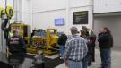 Several hundred customers toured the facility; here visitors take in the hydraulic component test stand. 