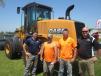 (L-R): Ben Mcburney, McCann Industries; Paul Stuart and Andy Bostic, both of H&S Concrete Constriction; and Brian Jones, McOCann Industries, stand in front of this Case 621F wheel loader.  