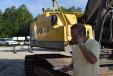 Robby Udelson, president of PowerTrac Machinery in Miami, Fla., takes a close look at some of the excavators.