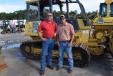 Jim Lawrence (L) of Jim Lawrence Trucking talks with Dwight Mast of North Florida Equipment Rental about buying a dozer.