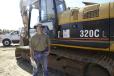 Mark Yarbrough of Interac Corporation inspects this Cat 320C L.
 