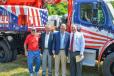 (L TO R) — Ted DeMattio, a Gradall retiree who drove the first Gradall off the New Philadelphia production line; Ray Ferwerda Jr. and Fred Ferwerda, descendants of the inventors of Gradall excavators, whose dealership purchased the 20,000th unit; and Mike Haberman, President of Gradall Industries.  