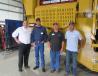 (L-R): Mike Thurman of Screen Machine Industries discusses the 5256T portable Impact Crusher with Paul Ford, Keith Hensel and Zane Luttrell of Power Equipment Company.
 