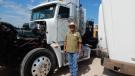 Ron Hail of Roger Properties, Midland, Texas, checks out one of the Freightliner T/A truck tractors.
 