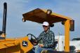 Paul Spencer of ATC in Bluewater, N.M., puts a John Deere 210 LE through its paces.
 