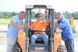 (L-R): Pete Fengen of P Denson Equipment, Little Ferry, N.J.; Ken Christensen, owner of Christensen Recycling, and his father, both of Sayreville, N.J., appear to be very interested in this Case skid steer. 