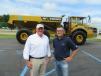John Waldron (L), district sales manager of Volvo Construction Equipment, stands with Robert O’Rourke, Alta branch manager, in front of Volvo’s 50th anniversary A40G Golden Hauler.
 