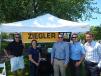 Event sponsor, Ziegler CAT, provided kabobs and refreshments. (L-R) are Luke Magnuson, territory manager, Bloomington,  Minn.; Jenny Covers, advertising event coordnator; Charlie Norgaard, territory manager, Bloomington; Chad Adams, territory manager, Rochester, Minn.; and Bryce Bintzler, territory manager, Minneapolis, Minn.
 