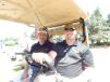 Keith Yetzer (L), president of YTS Tree Care Experts, Rogers, Minn., and Scott Weness, sales manager of RDO Equipment Co., take a ride on the course.
 