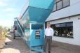 Colin Clements, global product line director, beside a 1966 MK1 screening machine. This was the sixth machine built and remains a permanent feature at the front of the Dungannon plant.  