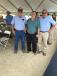 Michael Lindsay (L) and C.M. Lindsay Jr (R), both with C.M. Lindsay & Sons in Lumberton, N.C., congratulate Johnny Parker for his 50 years of service 