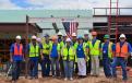 Project team members celebrate topping-out of the New Mexico State Veterans’ Home Alzheimer’s and Skilled Nursing Facility.
 